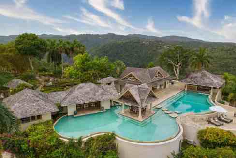 Luxury villa with pool and lush tropical landscape in Montego Bay.